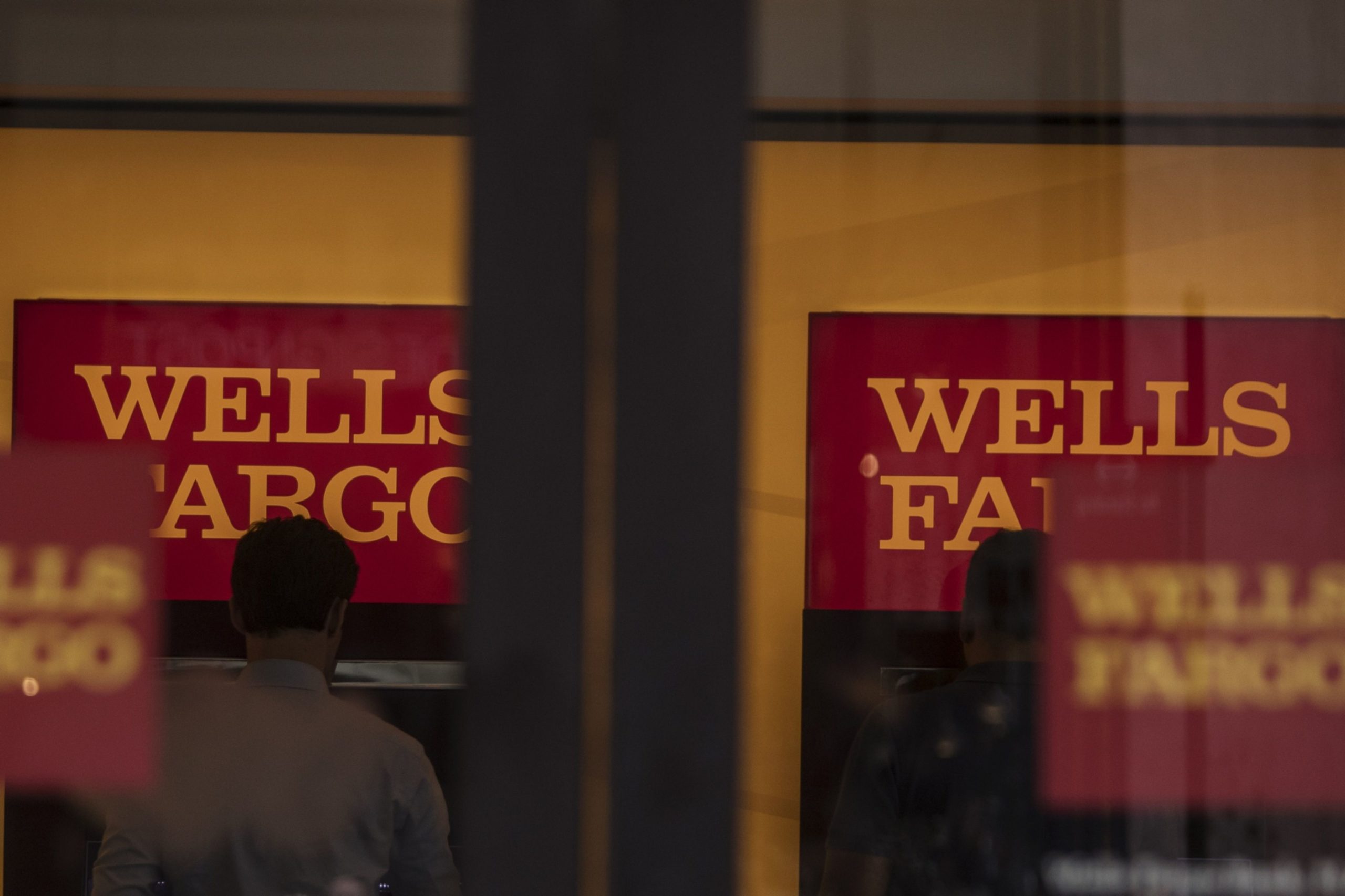Customers use automatic teller machines (ATM) inside a Wells Fargo & Co. bank branch in New York, U.S., on Tuesday, July 2, 2019. Photographer: Victor J. Blue/Bloomberg