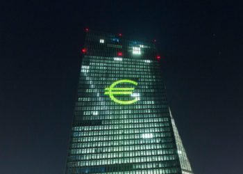 An illuminated euro currency symbol is projected on to the European Central Bank (ECB) headquarters. Photographer: Martin Leissl/Bloomberg Mercury