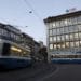 Trams pass by the UBS Group AG headquarters in Zurich, Switzerland, on Monday, Oct. 14, 2019. The spying scandal roiling Credit Suisse Group AG has also created a big headache at UBS a stone's throw away in