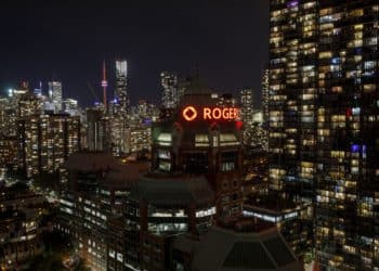 Rogers Communications Inc. logo displayed atop the the company's headquarters in Toronto, Ontario, Canada. Photographer: Cole Burston/Bloomberg