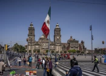 A Mexican flag flies at Constitution Square, known as Zocalo, in Mexico City, Mexico, on Friday Feb. 11, 2022.  Photographer: Alejandro Cegarra/Bloomberg
