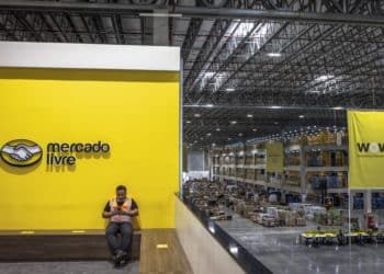 A worker takes a break at the MercadoLibre fulfillment center on Black Friday in Sao Paulo, Brazil, on Friday, Nov. 26, 2021. After a 2-year period in which Brazilians have greatly matured when it comes to online shopping, e-commerce platforms are ready for Black Friday.