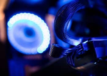 Lights illuminate graphic processing unit (GPU) cables inside a 'mining rig' computer, used to mine the Electroneum cryptocurrency, in Budapest, Hungary, on Wednesday, Jan. 31, 2018. Cryptocurrencies are not living up to their comparisons with gold as a store of value, tumbling Monday as an equities sell-off in Asia extended the biggest rout in global stocks in two years. Photographer: Akos Stiller/Bloomberg