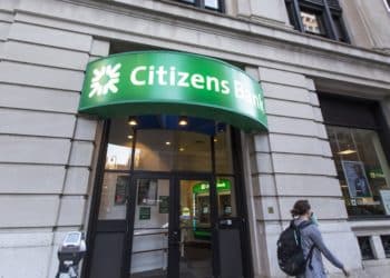 A pedestrian passes in front of a Citizens Financial Group Inc. bank branch in downtown Boston, Massachusetts, U.S., on Tuesday, Oct. 10, 2017. Citizens Financial Group Inc. is scheduled to release earnings figures on October 20. Photographer: Scott Eisen/Bloomberg