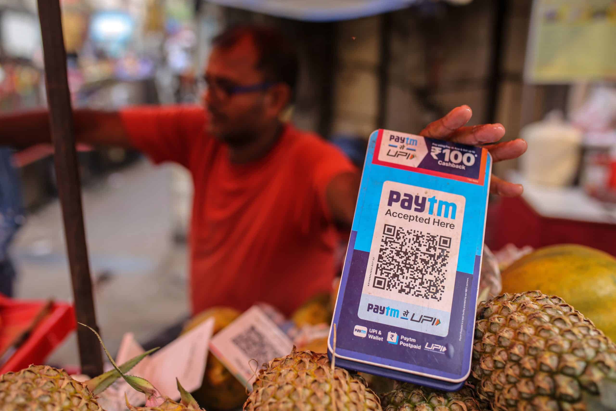 Paytm shares climb after payments giant reports narrower loss