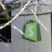 A logo outside Shopify headquarters in Ottawa, Ontario, Canada, on Tuesday, Feb. 14, 2023. Shopify Inc. was among the first technology giants to slash its workforce during last years market rout. Now, some investors say its stock is poised to outperform peers over the course of 2023 as those job cuts translate into lower costs, narrower losses and better cash flow.