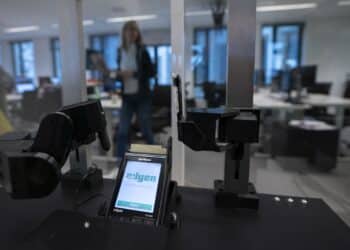 A robotic arm sits beside a contactless payment processing device, manufactured by VeriFone Systems Inc., in the testing room inside the Adyen NV headquarters in Amsterdam, Netherlands, on Monday, Oct. 29, 2018. Investors have flocked to fintech company Adyen, whose shares have risen from 240 euros at the time of the IPO, to as much as 609 euros a month later. Photographer: Jasper Juinen/Bloomberg