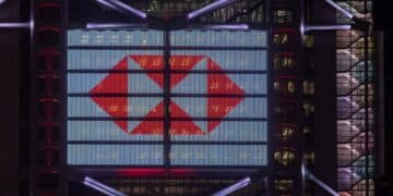 The HSBC Holdings Plc logo is displayed on the facade of the company's headquarters in Hong Kong, China, on Friday, Feb. 18, 2022. HSBC is scheduled to release earnings results on Feb. 22. Photographer: Paul Yeung/Bloomberg