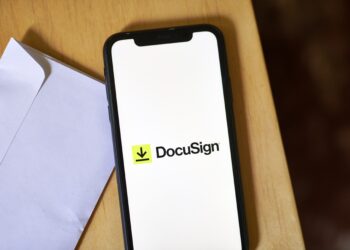 The DocuSign logo on a smartphone arranged in the Brooklyn borough of New York, US, on Wednesday, Aug. 30, 2023. DocuSign Inc. is scheduled to release earnings figures on September 7. Photographer: Gabby Jones/Bloomberg