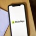The DocuSign logo on a smartphone arranged in the Brooklyn borough of New York, US, on Wednesday, Aug. 30, 2023. DocuSign Inc. is scheduled to release earnings figures on September 7. Photographer: Gabby Jones/Bloomberg