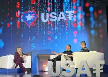 Tether Holdings CEO Paolo Ardoino, center, and Bo Hines, CEO of Tether USAT, right, announced plans to issue a US regulated, dollar-backed stablecoin during a press conference in New York on Friday, Sept. 12, 2025. Journalist Eleanor Terrett, left, interviews them.